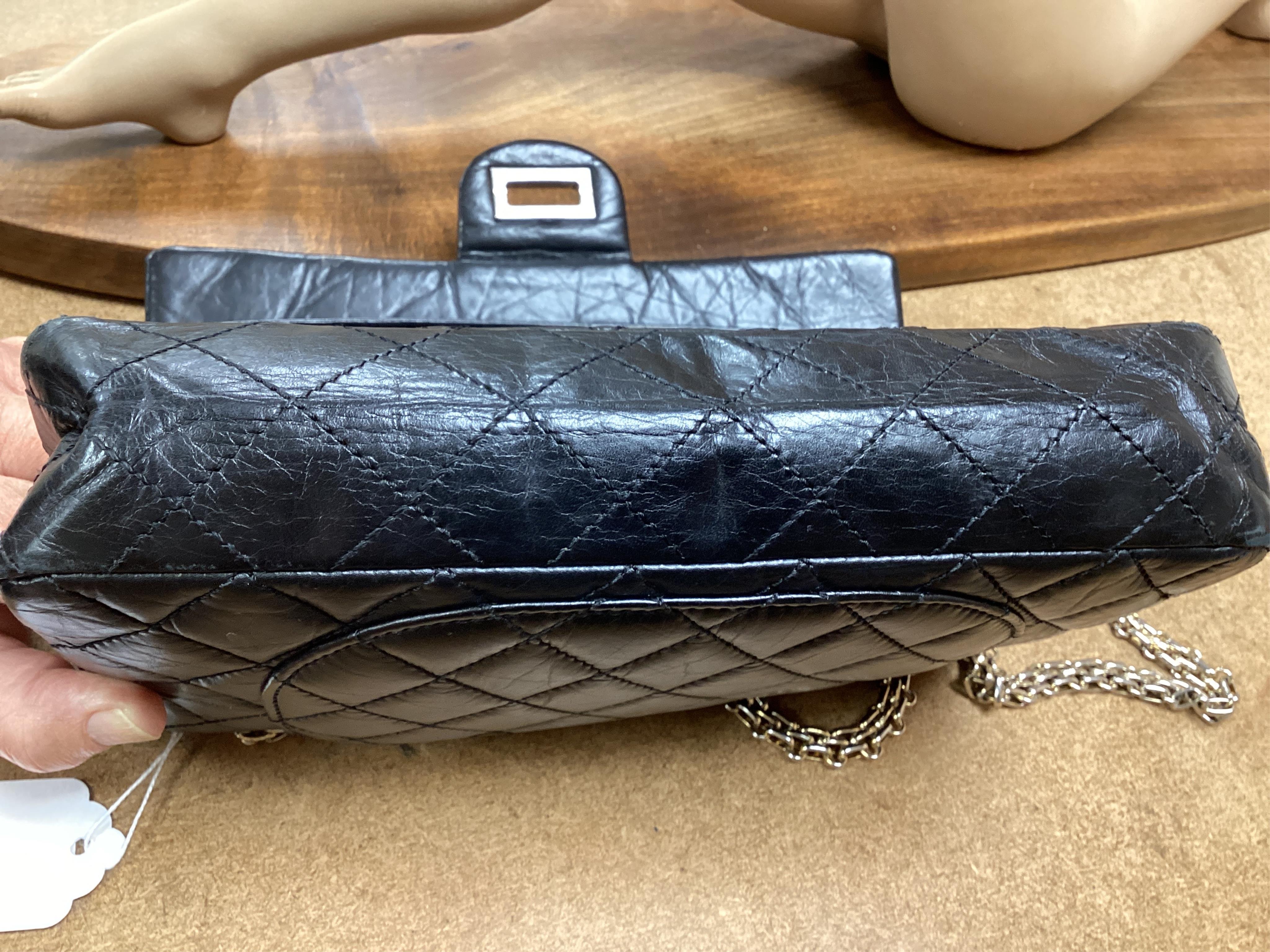 A Chanel 2.55 black leather handbag